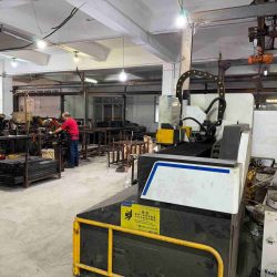 Worker inspecting electric bed production